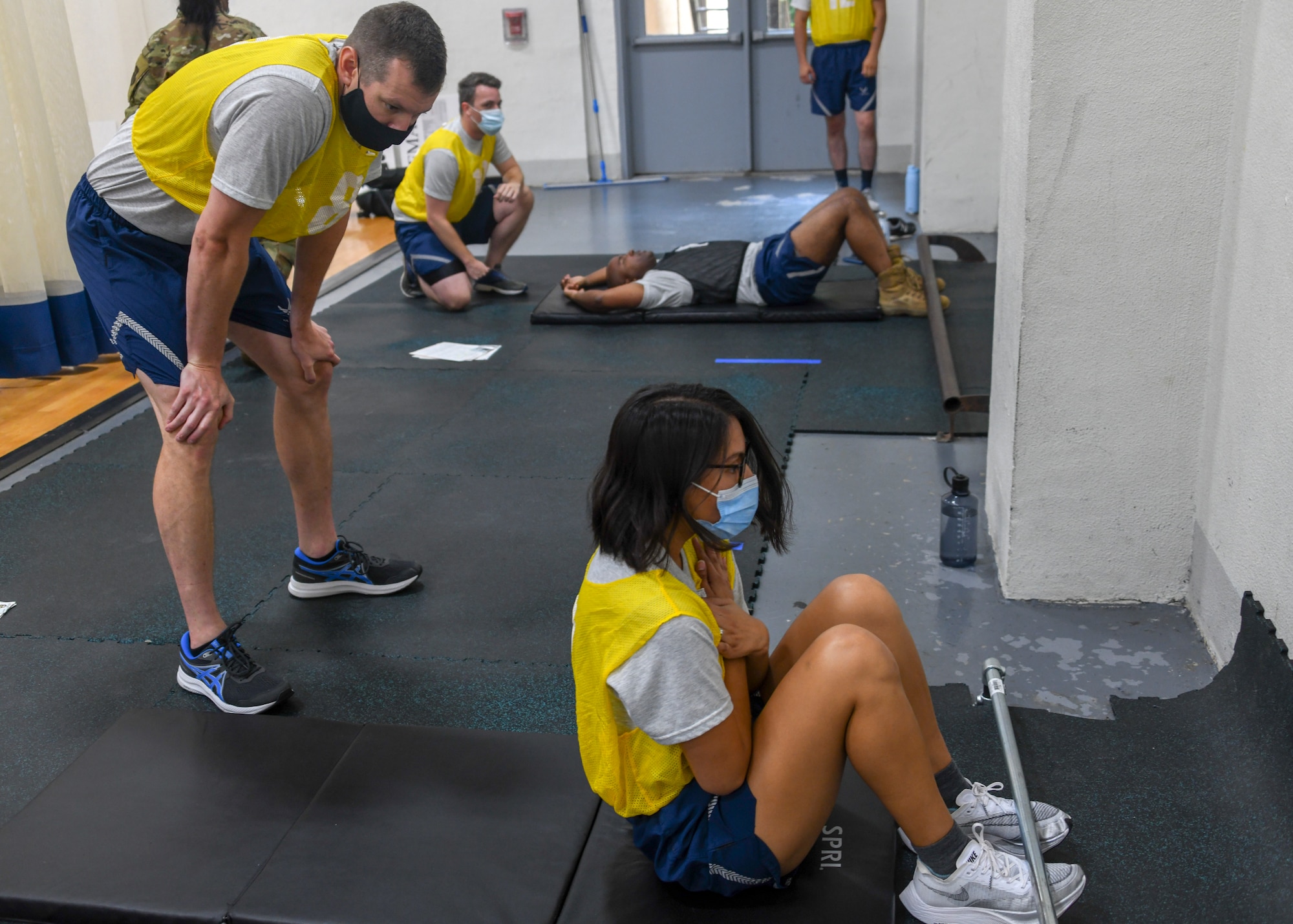 459th Air Refueling Wing Airmen count the push-ups of their partners August 14, 2021, at Joint Base Andrews, Md. The push-up portion of the test now weighs more towards the overall score being 20 points as opposed to 10 points. (U.S. Air Force photo by Senior Airman Andreaa Phillips)