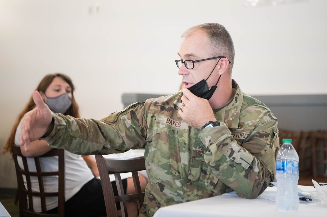 Chief Master Sgt. Timothy Bayes, 436th Airlift Wing command chief, discusses the implementation of lactation rooms around the base during the Women’s Equality Day luncheon on Dover Air Force Base, Delaware, Aug. 26, 2021. The discussion covered several issues faced by women serving in the armed forces. (U.S. Air Force photo by Mauricio Campino)
