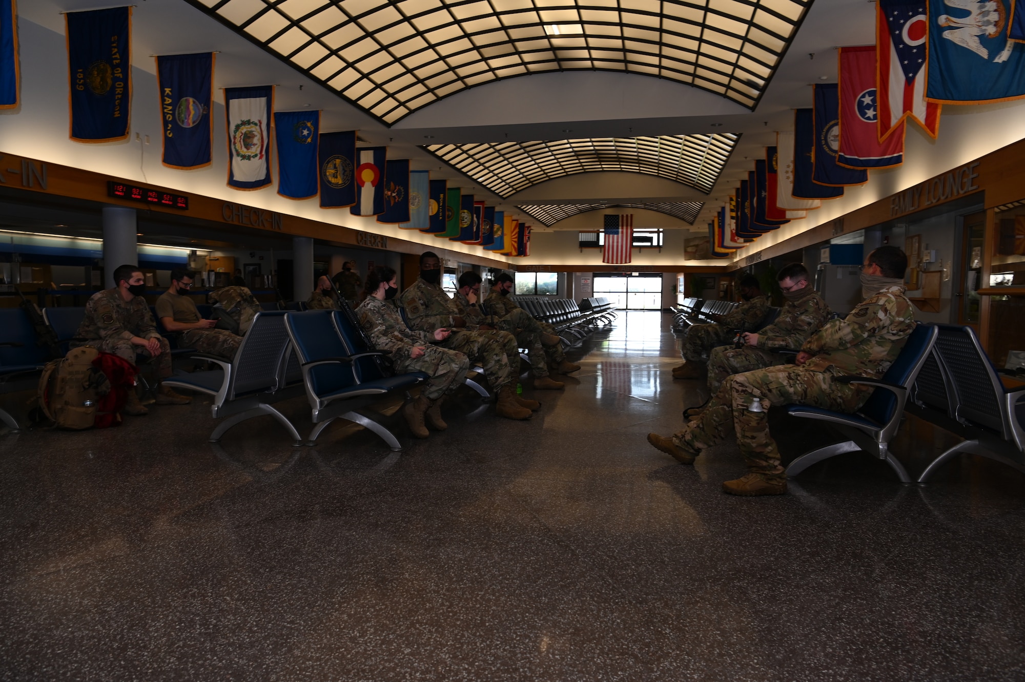 U.S Airmen assigned to the 621st Contingency Response Group prepare to depart from the airport terminal Aug. 14, 2021, at Joint Base McGuire-Dix-Lakehurst, New Jersey.  The 621st CRW deployed Airmen from the 621st and 821st CRGs as well as the 621st Air Mobility Advisory Group to support the evacuation of American citizens, Special Immigration Visa applicants and other vulnerable Afghans from Afghanistan.  (U.S. Air Force photo by Tech. Sgt. Luther Mitchell Jr.)