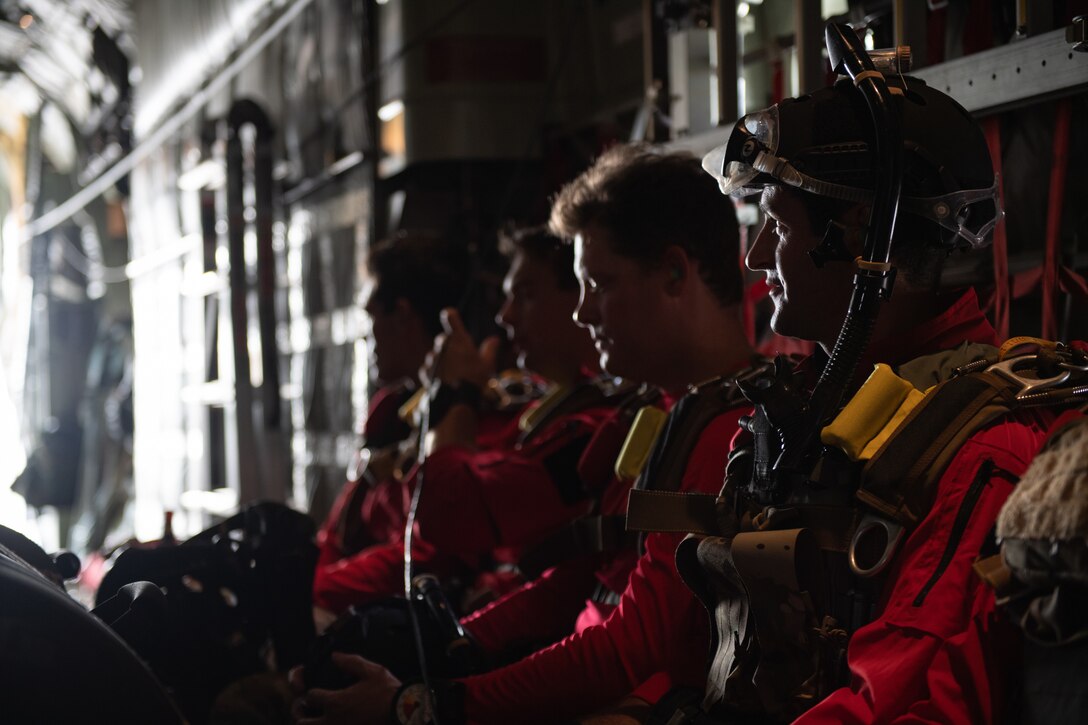 Photo of Airmen sitting on an aircraft