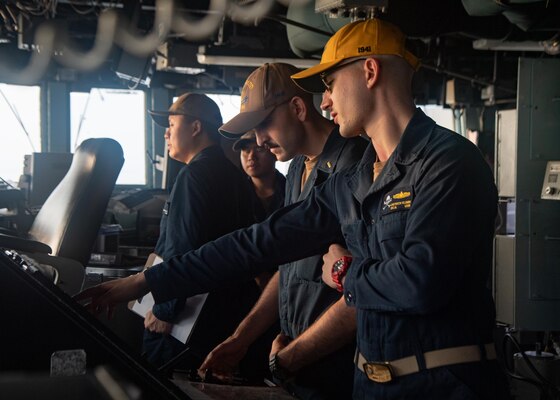 TAIWAN STRAIT (Aug. 27, 2021) Sailors stand watch in the pilot house aboard Arleigh-burke class guided-missile destroyer USS Kidd (DDG 100) while conducting routine operations, Aug. 27. Kidd is deployed supporting Commander, Task Force (CTF) 71/Destroyer Squadron (DESRON) 15, the Navy’s largest forward-deployed DESRON and U.S. 7th Fleet’s principal surface force.
