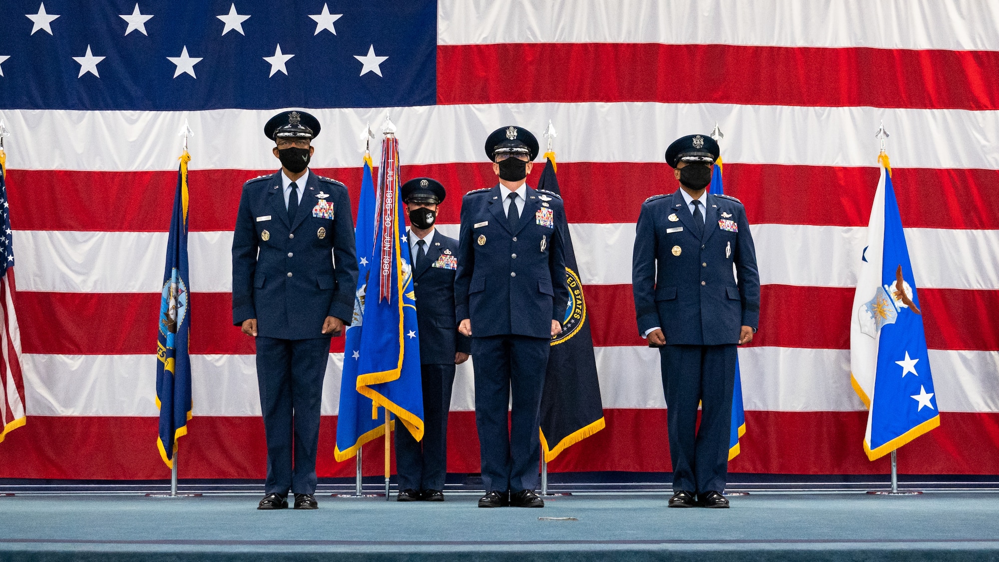 Air Force Chief of Staff Gen. CQ Brown, Jr., Gen. Timothy Ray, outgoing Air Force Global Strike Command commander, and Gen. Anthony Cotton, incoming AFGSC commander, stand at the position of attention during the AFGSC change of command ceremony at Barksdale Air Force Base, Louisiana, Aug. 27, 2021. The ceremony is a military tradition that represents a formal transfer of authority and responsibility for a unit from one commanding or flag officer to another. (U.S. Air Force photo by Senior Airman Jacob B. Wrightsman)