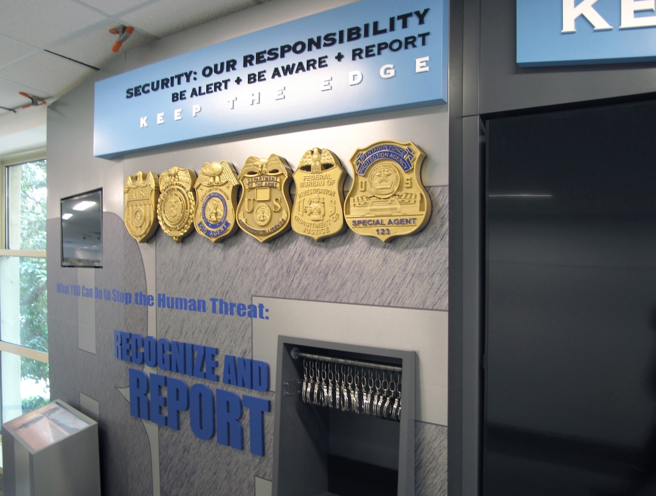 An exhibit shows six different badges from DOD’s security professionals.