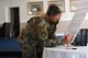 Col. Katrina Stephens, installation commander, signs a proclamation declaring Women's Equality Day prior to a panel discussion at Hanscom Air Force Base, Mass., Aug. 26. Women's Equality Day, first celebrated in 1971, is observed Aug. 26 to commemorate the 1920 passage of the 19th Amendment to the Constitution, granting women the right to vote. (U.S. Air Force photo by Linda LaBonte Britt)