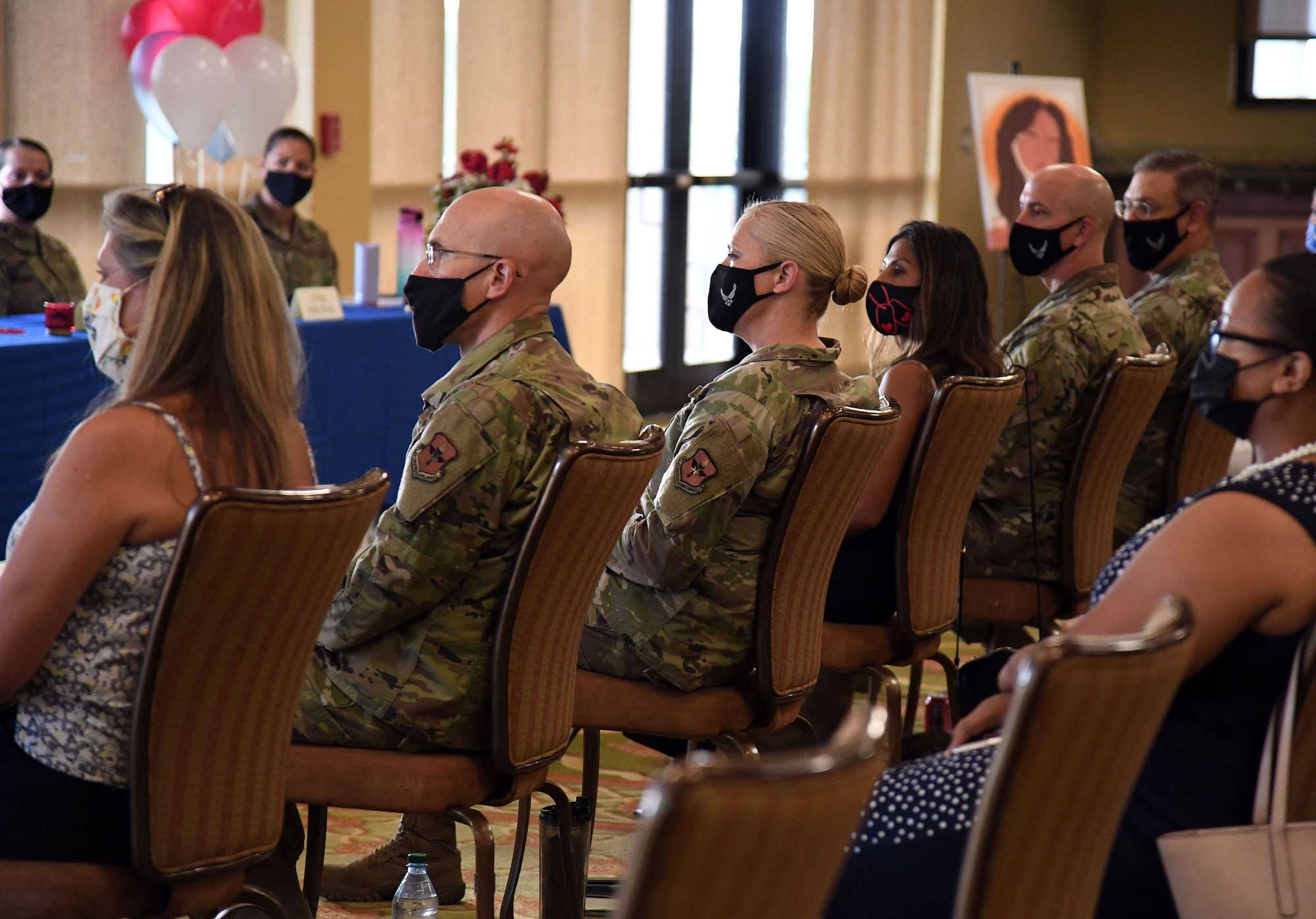 Keesler leadership and personnel attend the Women's Equality Day Celebration inside the Bay Breeze Event Center at Keesler Air Force Base, Mississippi, Aug. 26, 2021. The intention of the event, which included a panel discussion, was to highlight different perspectives of ongoing efforts to achieve women's equality. (U.S. Air Force photo by Kemberly Groue)