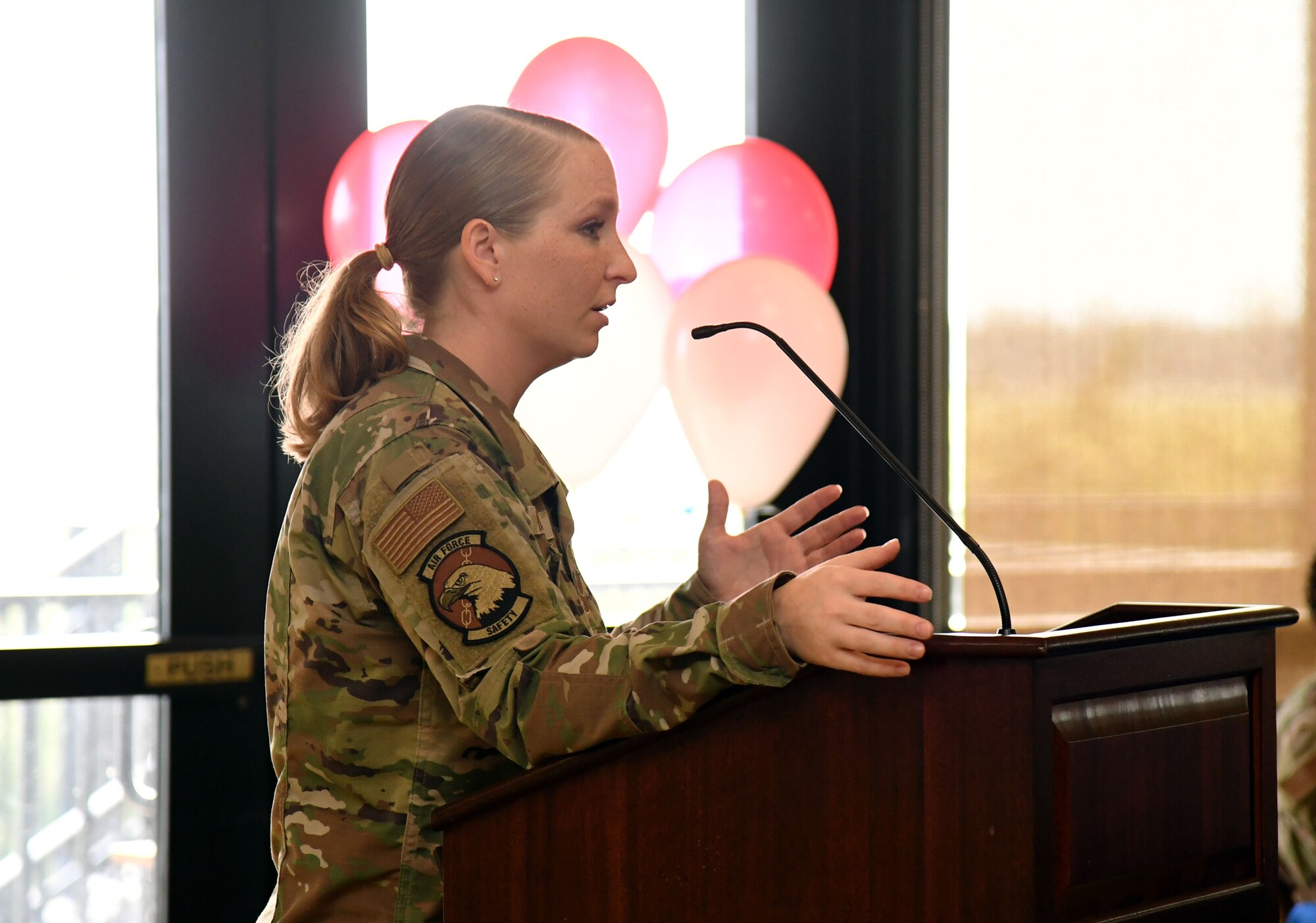 U.S. Air Force Staff Sgt. Taylor Boeckel, 81st Training Wing occupational safety technician, delivers remarks during the Women's Equality Day Celebration inside the Bay Breeze Event Center at Keesler Air Force Base, Mississippi, Aug. 26, 2021. The intention of the event, which included a panel discussion, was to highlight different perspectives of ongoing efforts to achieve women's equality. (U.S. Air Force photo by Kemberly Groue)