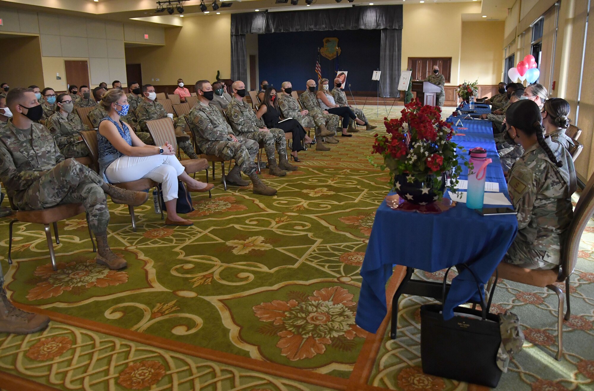 Keesler leadership and personnel attend the Women's Equality Day Celebration inside the Bay Breeze Event Center at Keesler Air Force Base, Mississippi, Aug. 26, 2021. The intention of the event, which included a panel discussion, was to highlight different perspectives of ongoing efforts to achieve women's equality. (U.S. Air Force photo by Kemberly Groue)