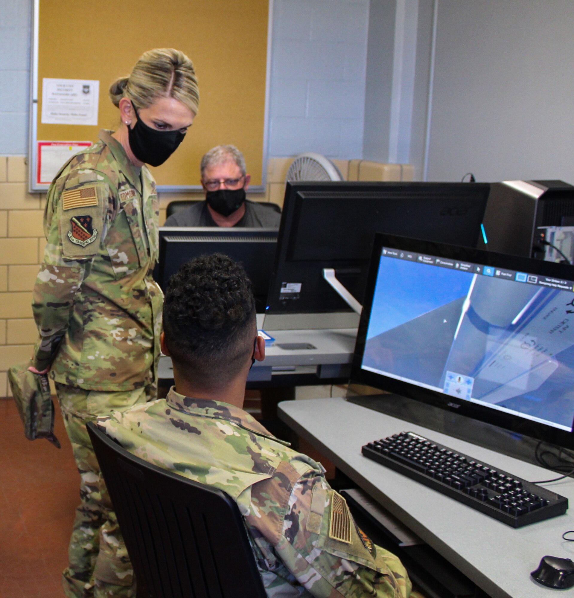 Maj. Gen. Michele C. Edmondson talks to avionics student Airman 1st Class Justin Valles