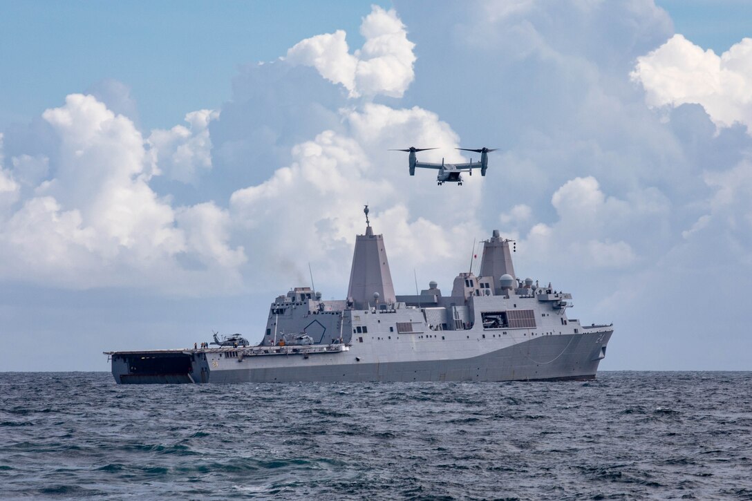 An MV-22 Osprey transport aircraft assigned to the “Fighting Griffins” of Marine Medium Tiltrotor Squadron (VMM) 266 prepares to land on the San Antonio-class amphibious transport dock ship USS Arlington (LPD 24) to deliver supplies in support of the ship’s mission to Haiti, Aug. 18, 2021. Arlington is deployed to U.S Naval Forces Southern Command/U.S. 4th Fleet to support humanitarian assistance and disaster relief (HADR) efforts in Haiti following a 7.2-magnitude earthquake Aug. 14, 2021. (U.S. Navy photo by Mass Communication Specialist 2nd Class John Bellino)