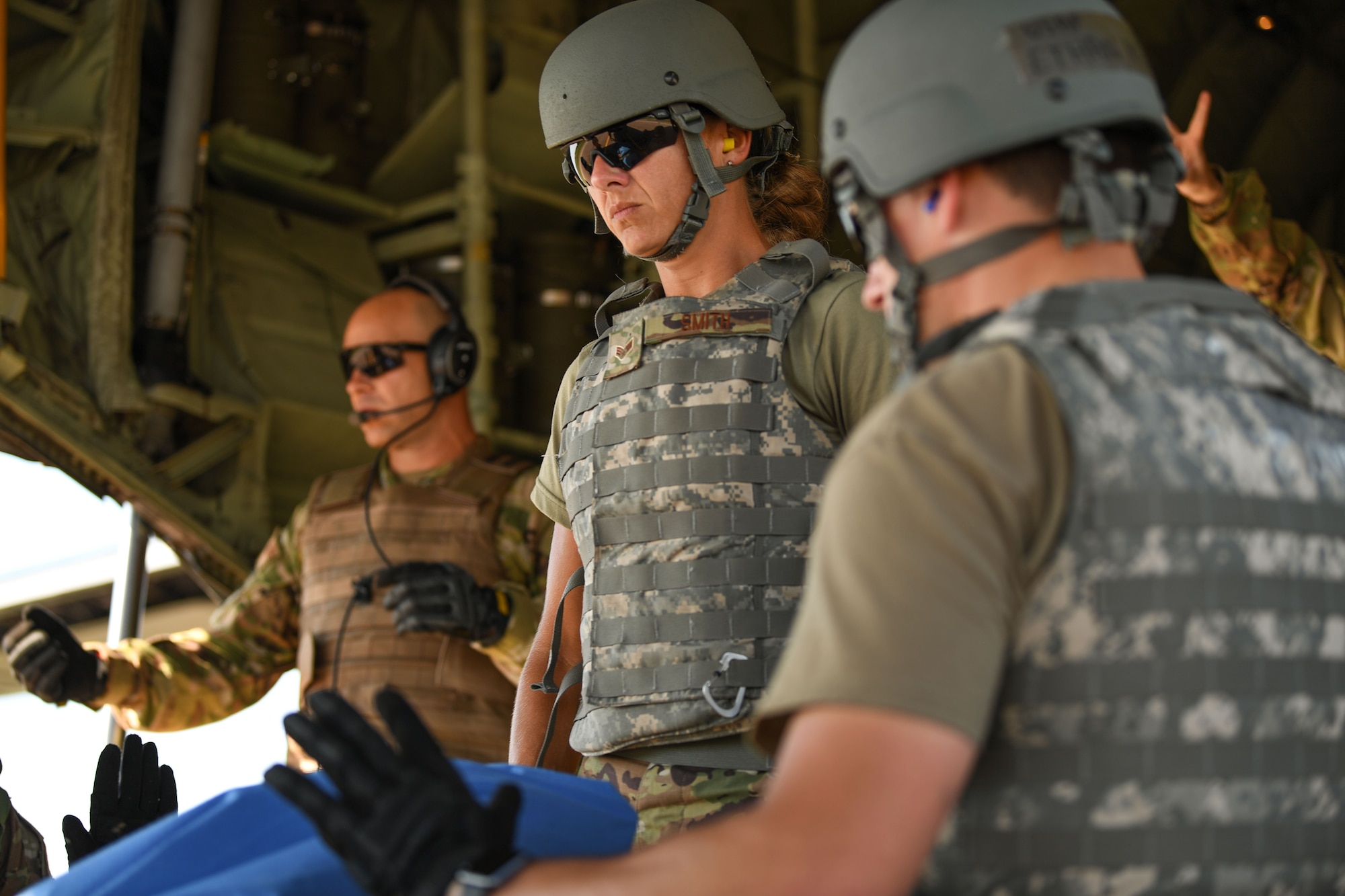 Capt. Matthew Allen, 36th Aeromedical Evacuation Squadron flight nurse (far left) is assigned to the 403rd Wing, Keesler Air Force Base, Mississippi. He works with other AE Airmen to offload a C-130J Super Hercules aircraft assigned to fellow Keesler AFB unit, the 815th Airlift Squadron, for aeromedical evacuation training during the exercise Patriot Warrior at Fort McCoy, Wisconsin, Aug. 15, 2021. Patriot Warrior is Air Force Reserve Command's premier exercise providing Airmen an opportunity to train with joint and international partners in airlift, aeromedical evacuation, and mobility support. The exercise builds on capabilities for the future fight, increasing the readiness, lethality and agility of the Air Force Reserve. (U.S. Air Force Photo by Tech. Sgt. Corban Lundborg)