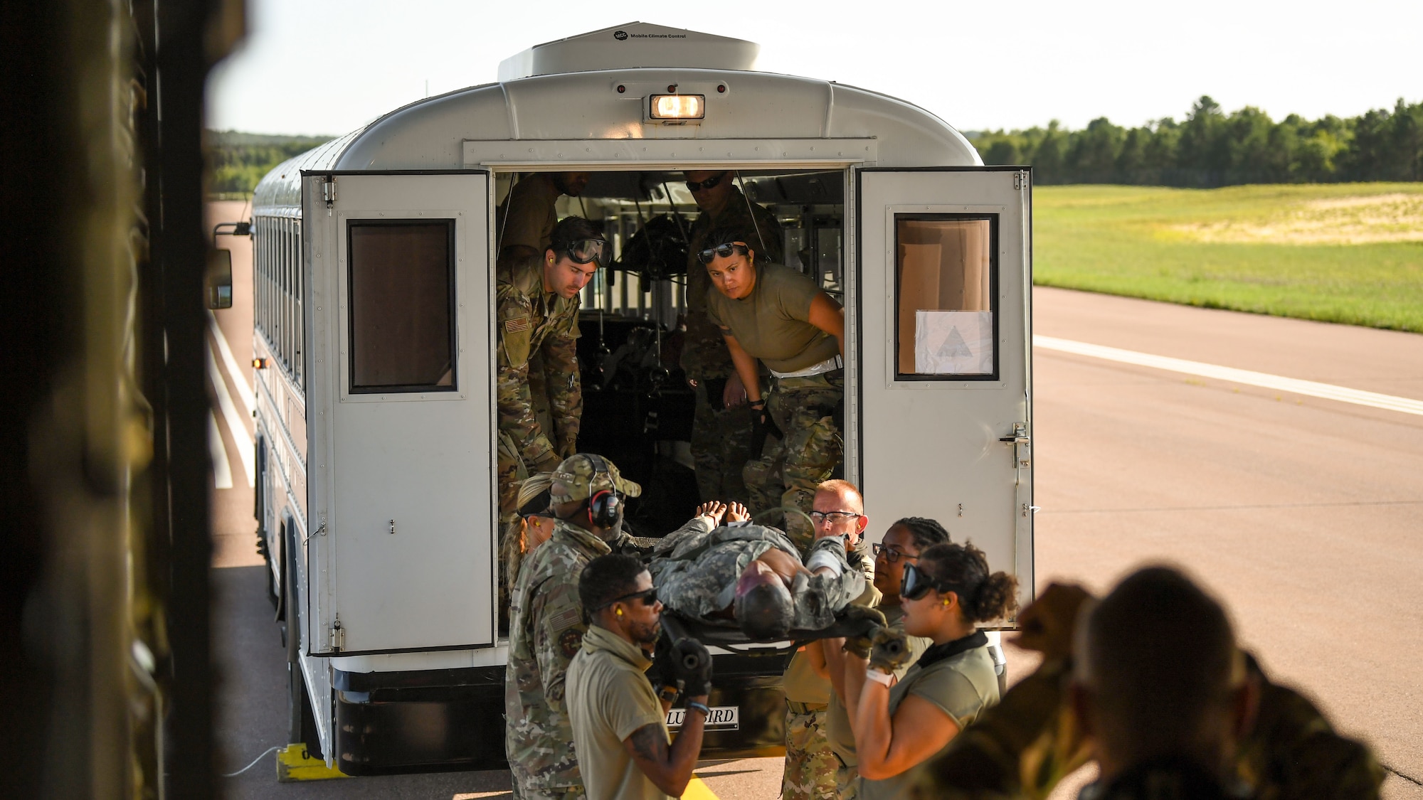 U.S. Airmen offload a C-130J Super Hercules aircraft assigned to the 815th Airlift Squadron, Keesler Air Force Base, Mississippi, for aeromedical evacuation training during exercise Patriot Warrior at Fort McCoy, Wisconsin, Aug. 13, 2021. Patriot Warrior is Air Force Reserve Command's premier exercise providing Airmen an opportunity to train with joint and international partners in airlift, aeromedical evacuation, and mobility support. The exercise builds on capabilities for the future fight, increasing the readiness, lethality and agility of the Air Force Reserve. (U.S. Air Force Photo by Tech. Sgt. Corban Lundborg)