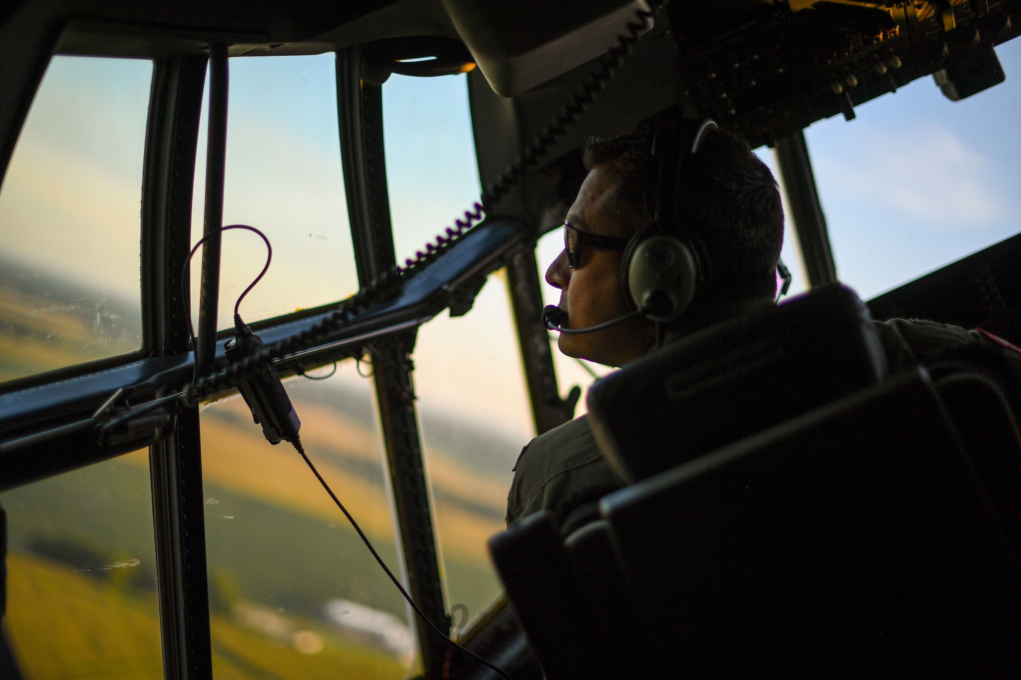 Maj. Aaron Sanchez, 815th Airlift Squadron pilot assigned to the 403rd Wing, Keesler Air Force Base, Mississippi, flies a U.S. Air Force C-130J Super Hercules aircraft from Fort McCoy Army Airfield for aeromedical evacuation training during exercise Patriot Warrior at Fort McCoy, Wisconsin, Aug. 14, 2021. Patriot Warrior is the Air Force Reserve Command's premier exercise providing Airmen an opportunity to train with joint and international partners in airlift, aeromedical evacuation, and mobility support. The exercise builds on capabilities for the future fight, increasing the readiness, lethality and agility of the Air Force Reserve. (U.S. Air Force Photo by Tech. Sgt. Corban Lundborg)