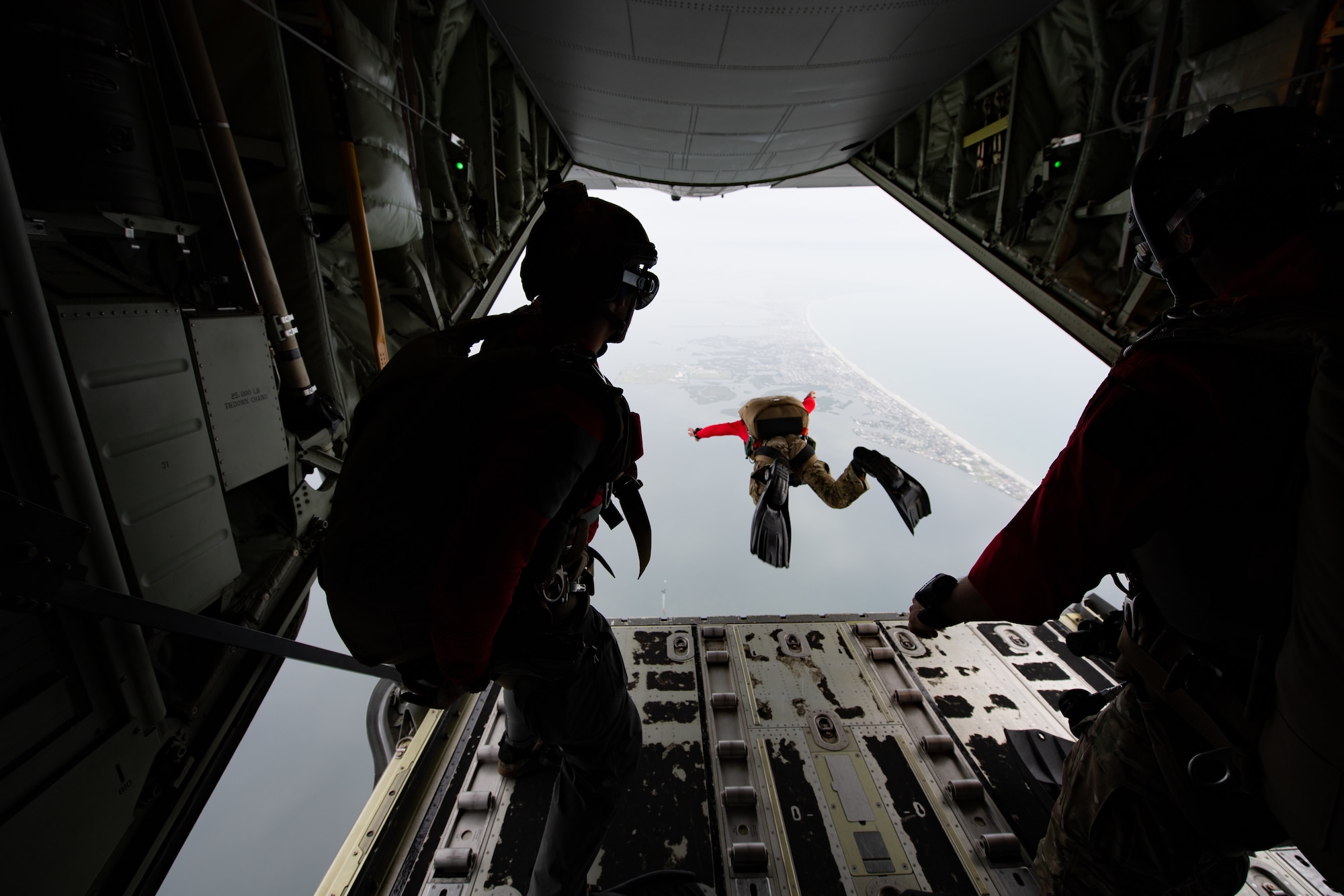 Photo of Airman jumping off an aircraft