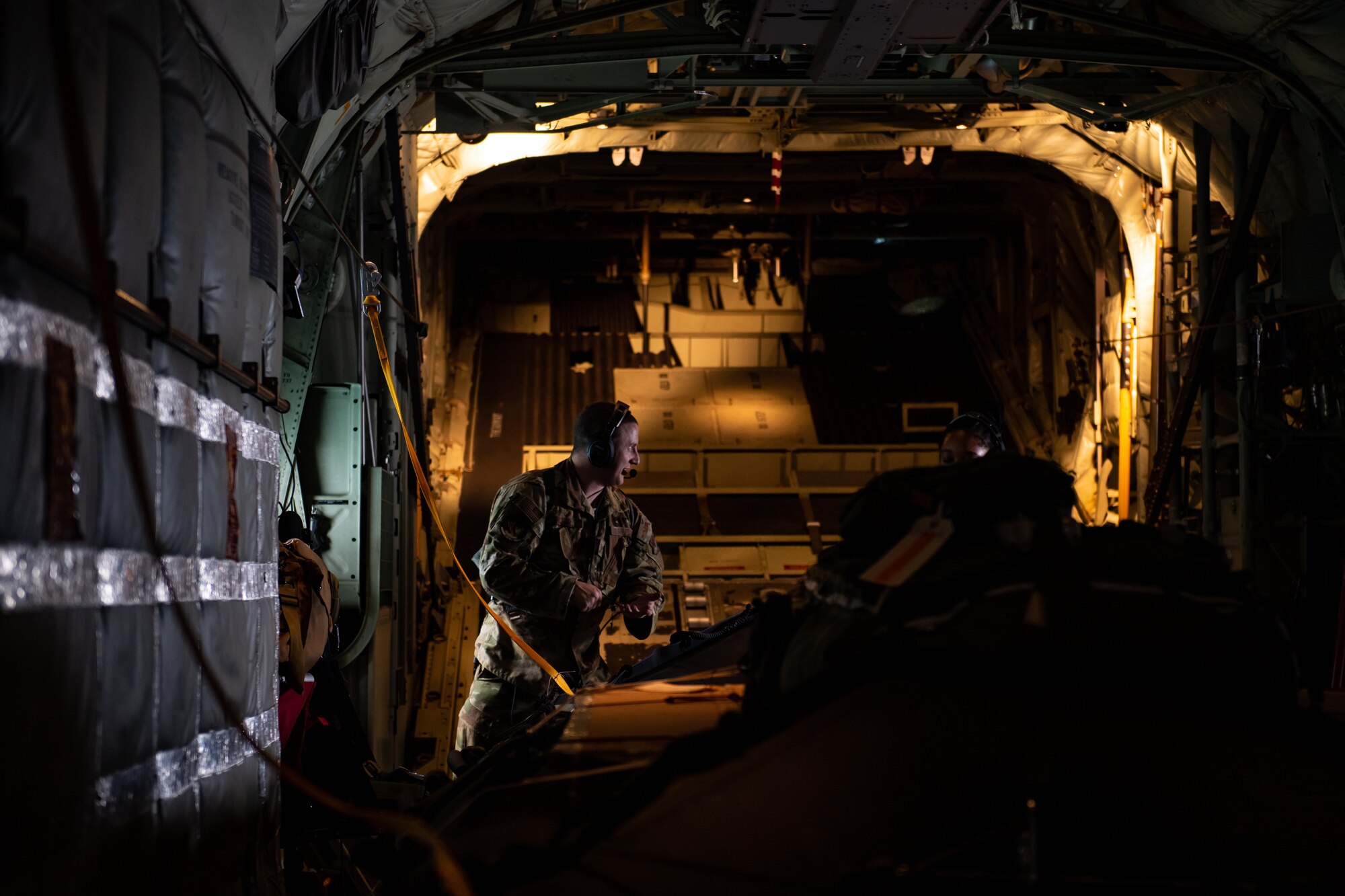 Photo of Airman working on aircraft