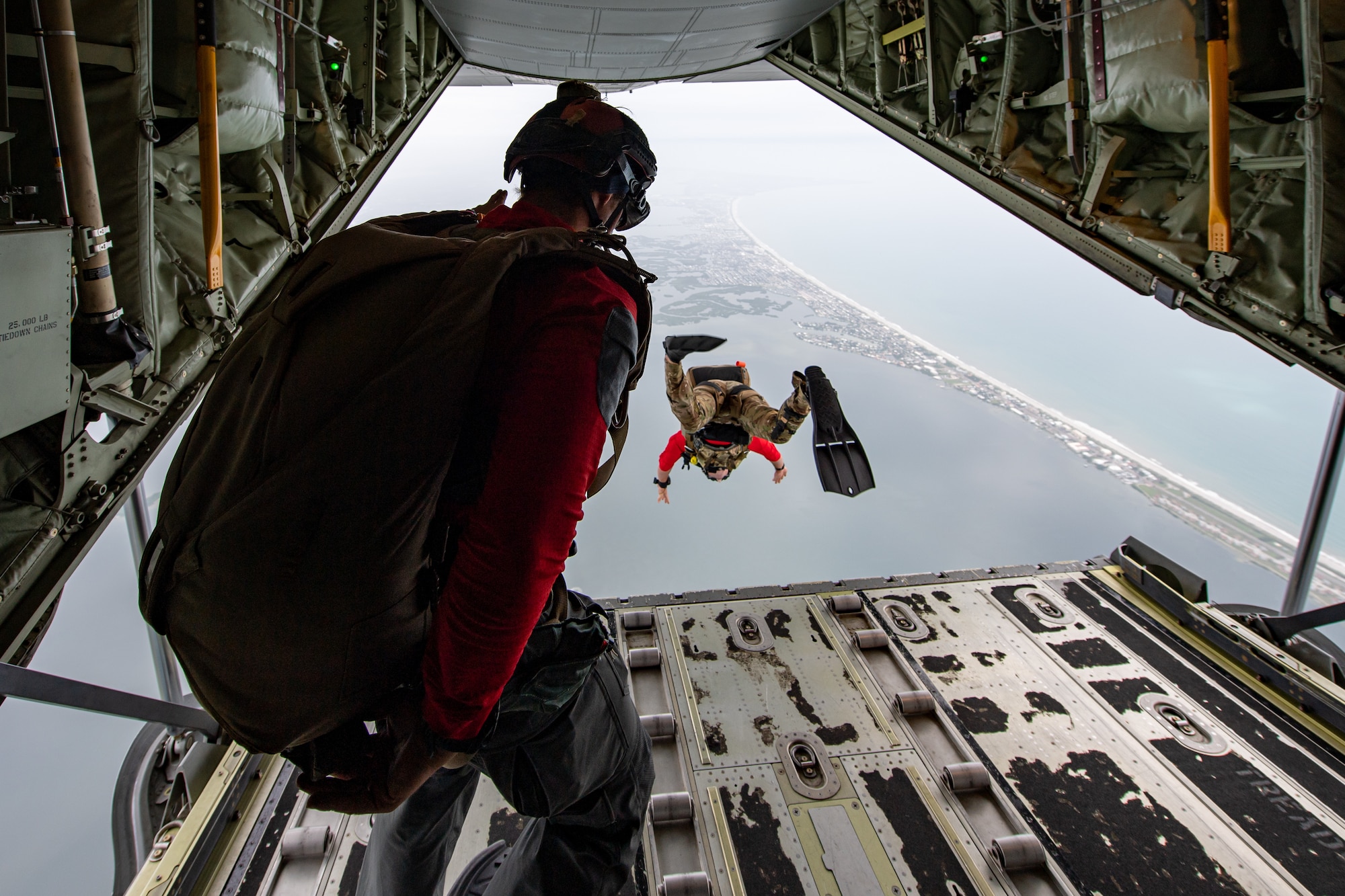 Photo of Airman jumping off an aircraft