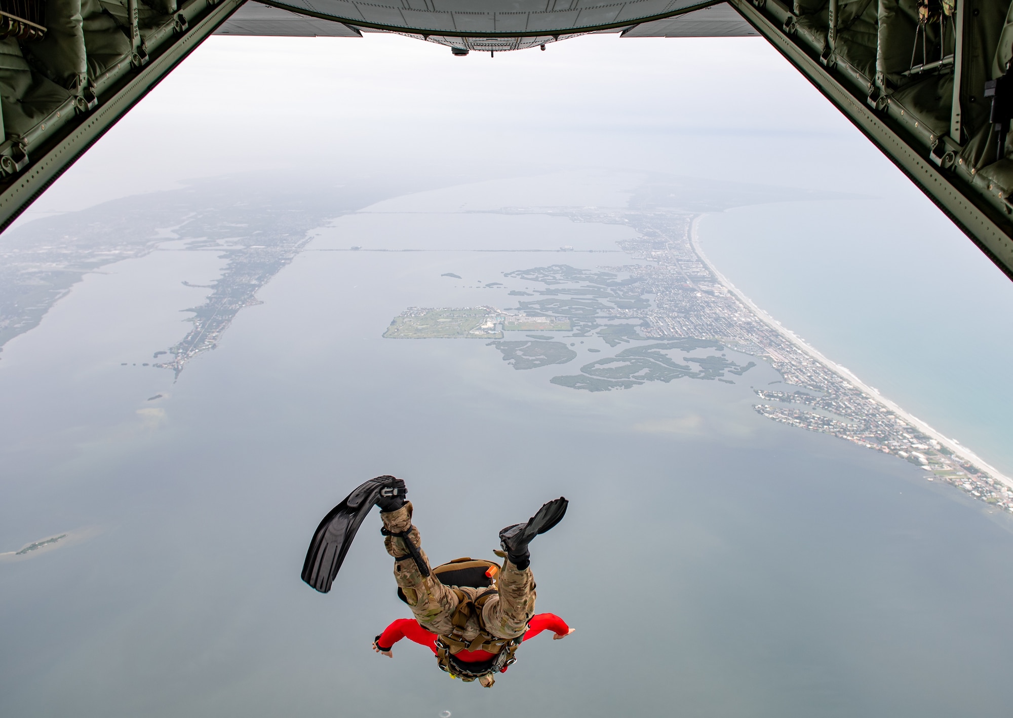 Photo of Airman jumping off an aircraft