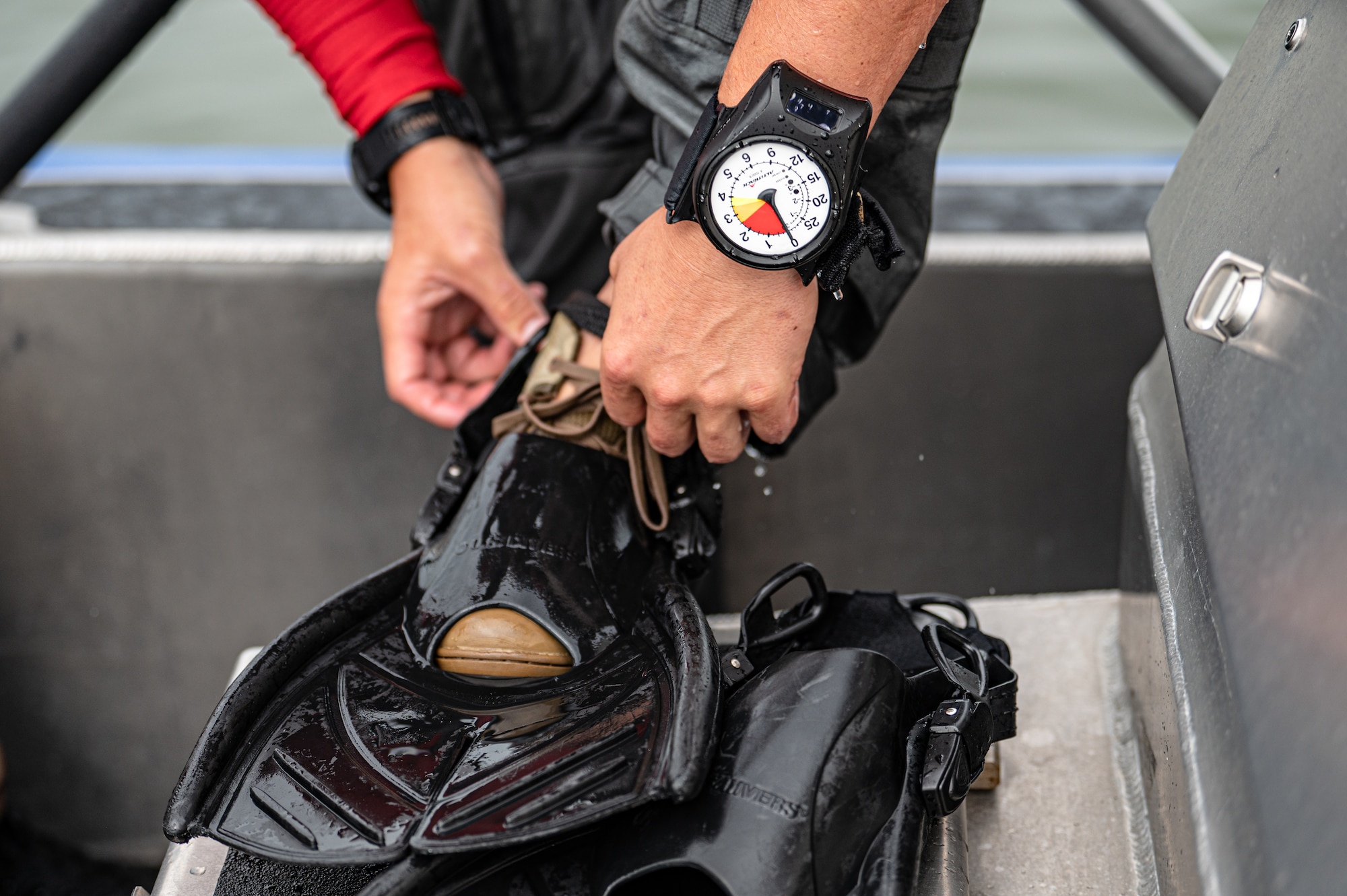 Photo of Airman removing a water fin