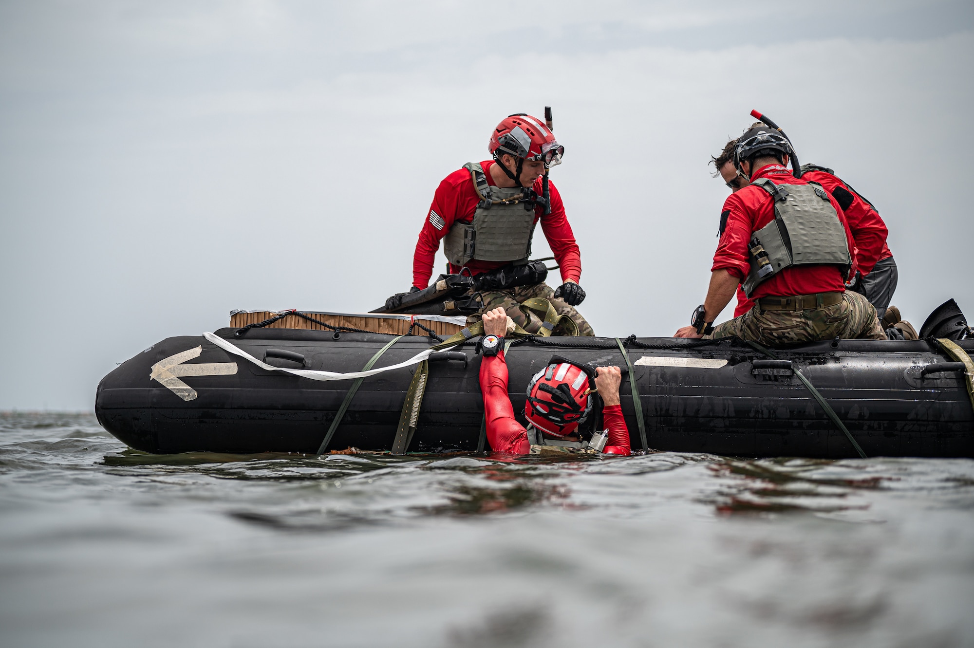 Photo of Airman climbing into a boat