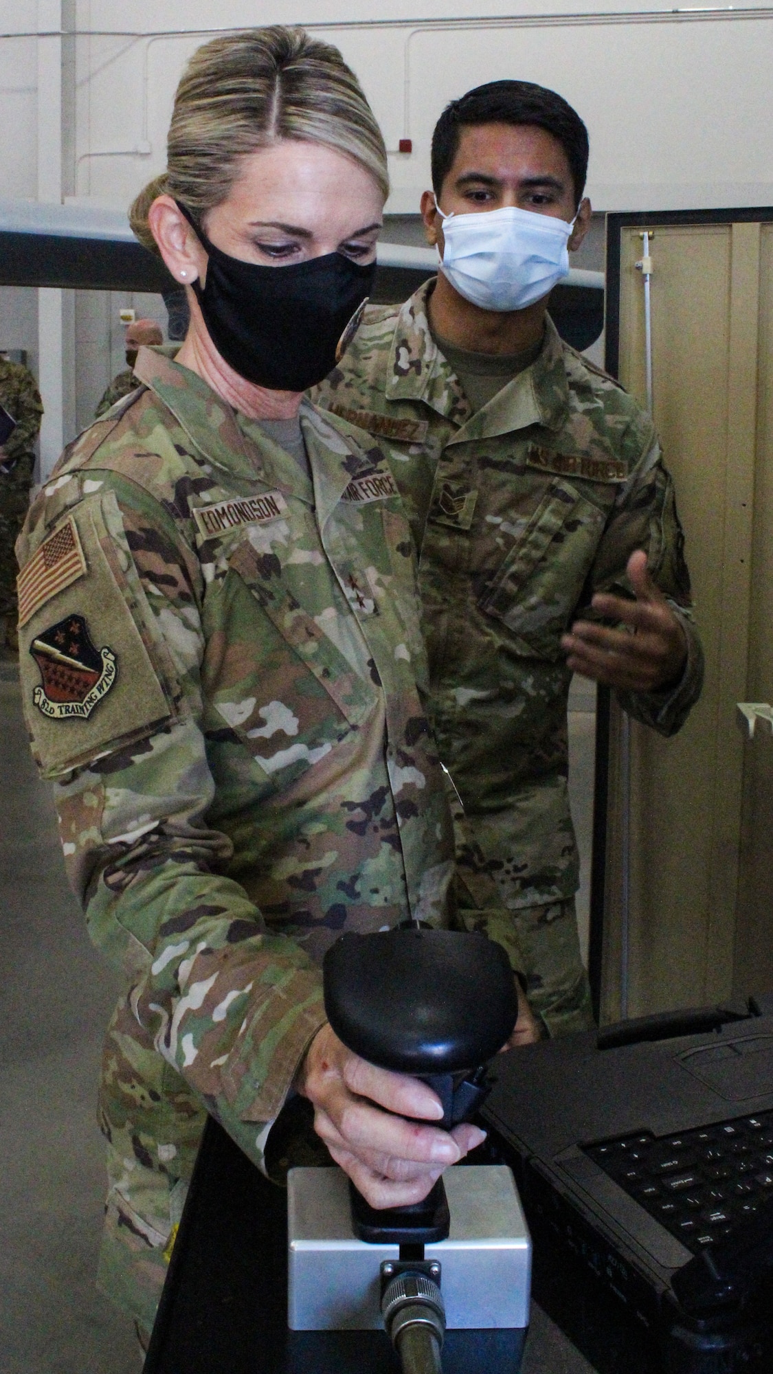 Staff Sgt. Daniel Hernandez, 365th Training Squadron avionics instructor, briefs 2nd Air Force Commander Maj. Gen. Michele C. Edmondson