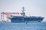 YOKOSUKA, Japan (Aug. 28, 2021) — The Nimitz-class aircraft carrier, USS Carl Vinson (CVN 70), navigates Tokyo Bay on the way to Commander, Fleet Activities Yokosuka for a scheduled port visit. Carl Vinson, homeported in San Diego, Calif., and the accompanying Carrier Strike Group (CSG 1), are on a rotational deployment in the U.S. 7th Fleet area of operations to enhance interoperability with partners and serve as a ready-response force in support of a free and open Indo-Pacific region. (U.S. Navy photo by Mass Communication Specialist 1st Class Ian Cotter)