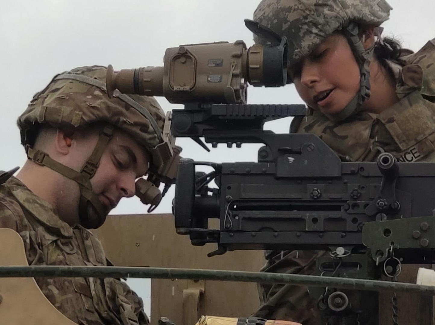 Soldiers with the Vermont National Guard's Headquarters Company, 572nd Brigade Engineer Battalion (Mountain), adjust a new Family of Crew Served Sight Systems at the Camp Ethan Allen Firing Range in Jericho, Vermont. From Aug. 16-20, Soldiers provided feedback that will be used to further refine the optic prior to full-rate production in 2023. (U.S. Army National Guard photo by Joshua Cohen)