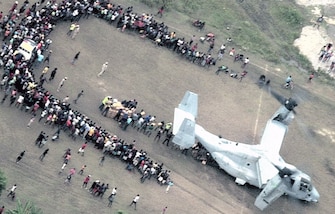 An overhead image captured by Navy P-8 Poseidon shows the offload and delivery of earthquake aid transported from a U.S Marine Corps MV-22B Osprey.