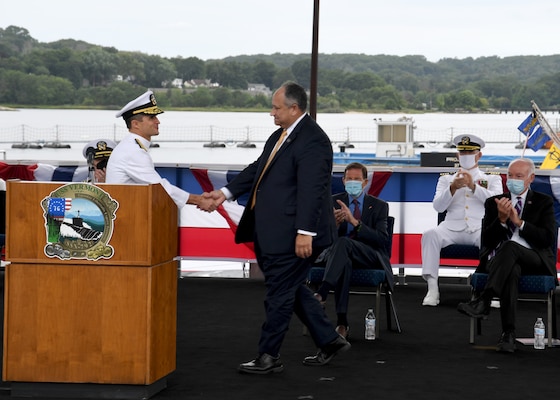 Secretary of the Navy Carlos Del Toro is welcomed by Rear Adm. Douglas Perry, the Navy’s director for undersea warfare, during a commissioning commemoration for the USS Vermont (SSN 792) onboard Naval Submarine Base New London in Groton, Conn., Aug. 28.