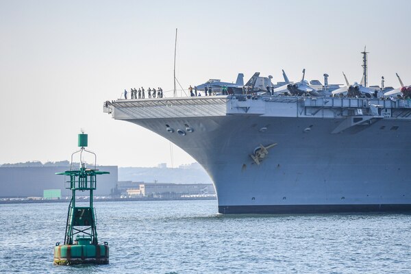 YOKOSUKA, Japan (Aug. 28, 2021) — The Nimitz-class aircraft carrier, USS Carl Vinson (CVN 70), arrives at Commander, Fleet Activities Yokosuka for a scheduled port visit. Carl Vinson, homeported in San Diego, Calif., and the accompanying Carrier Strike Group (CSG 1), are on a rotational deployment in the U.S. 7th Fleet area of operations to enhance interoperability with partners and serve as a ready-response force in support of a free and open Indo-Pacific region. (U.S. Navy photo by Mass Communication Specialist 1st Class Ian Cotter)