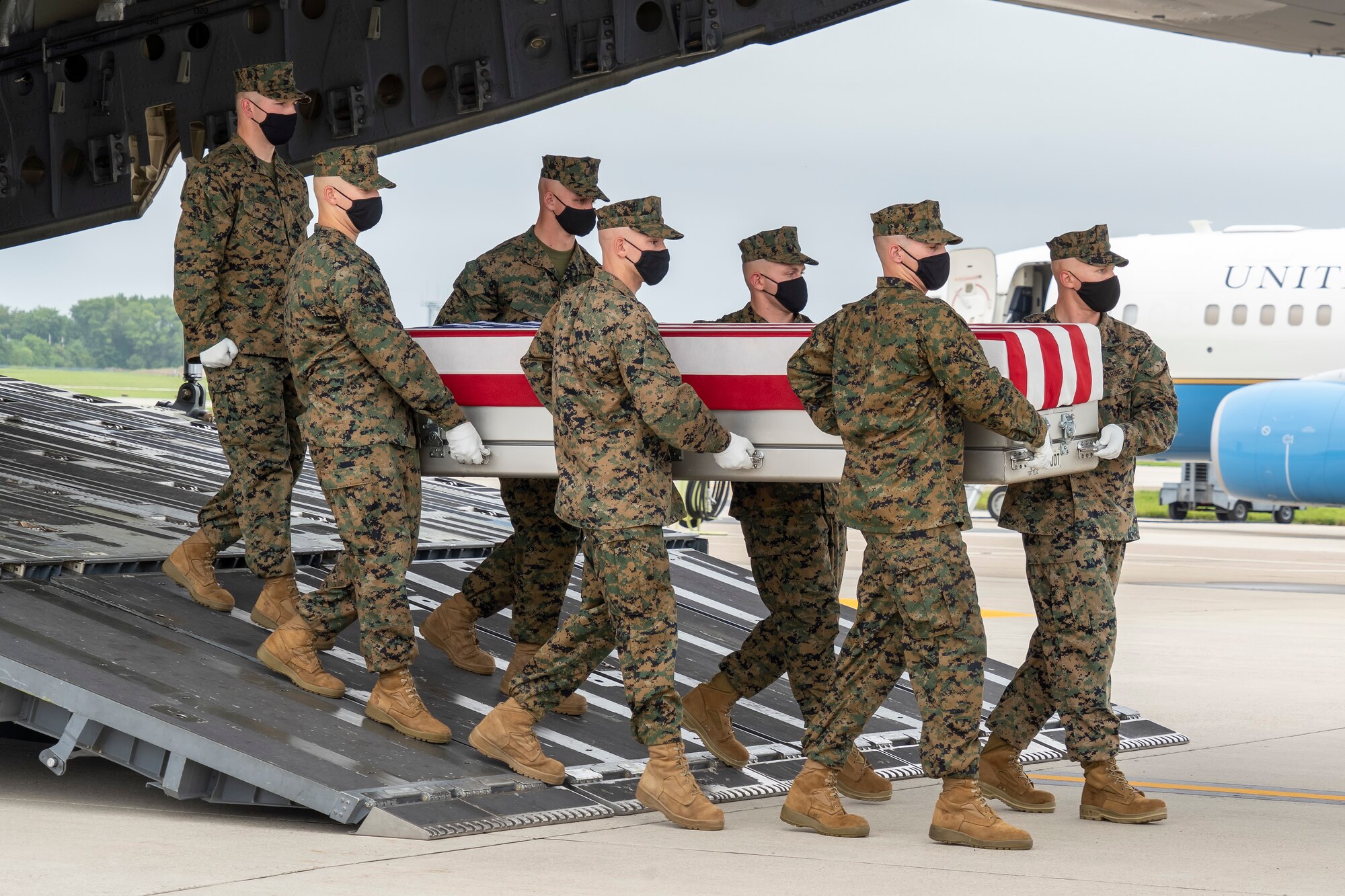 A U.S. Marine Corps carry team transfers the remains of Marine Corps Sgt. Johanny Rosariopichardo of Lawrence, Massachusetts, August 29, 2021 at Dover Air Force Base, Delaware. Rosariopichardo was assigned to 5th Marine Expeditionary Brigade, Naval Support Activity Bahrain. (U.S. Air Force photo by Jason Minto)