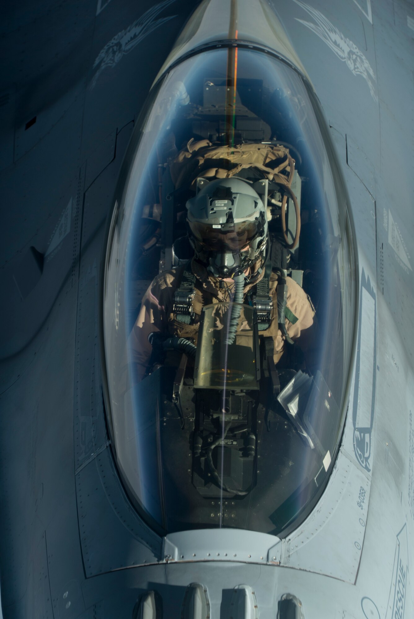Photo of pilot flying an aircraft.