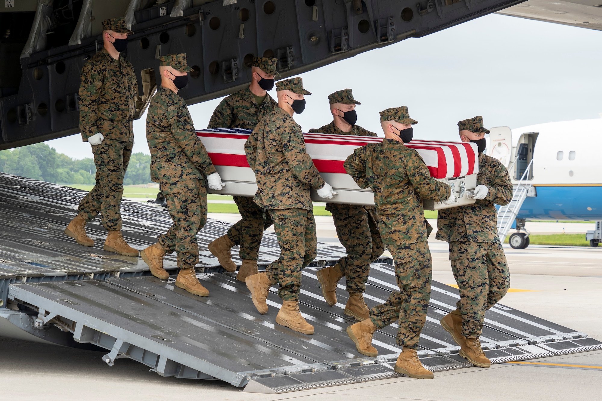 A U.S. Marine Corps carry team transfers the remains of Marine Corps Lance Cpl. Jared M. Schmitz of St. Charles, Missouri, August 29, 2021 at Dover Air Force Base, Delaware. Schmitz was assigned to 2nd Battalion, 1st Marine Regiment, 1st Marine Division, I Marine Expeditionary Force, Camp Pendleton, California. (U.S. Air Force photo by Jason Minto)