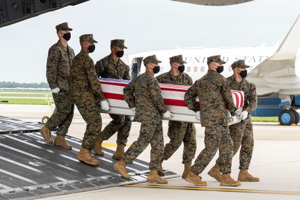 A U.S. Marine Corps carry team transfers the remains of Marine Corps Cpl. Daegan W. Page of Omaha, Nebraska, August 29, 2021 at Dover Air Force Base, Delaware. Page was assigned to 2nd Battalion, 1st Marine Regiment, 1st Marine Division, I Marine Expeditionary Force, Camp Pendleton, California. (U.S. Air Force photo by Jason Minto)