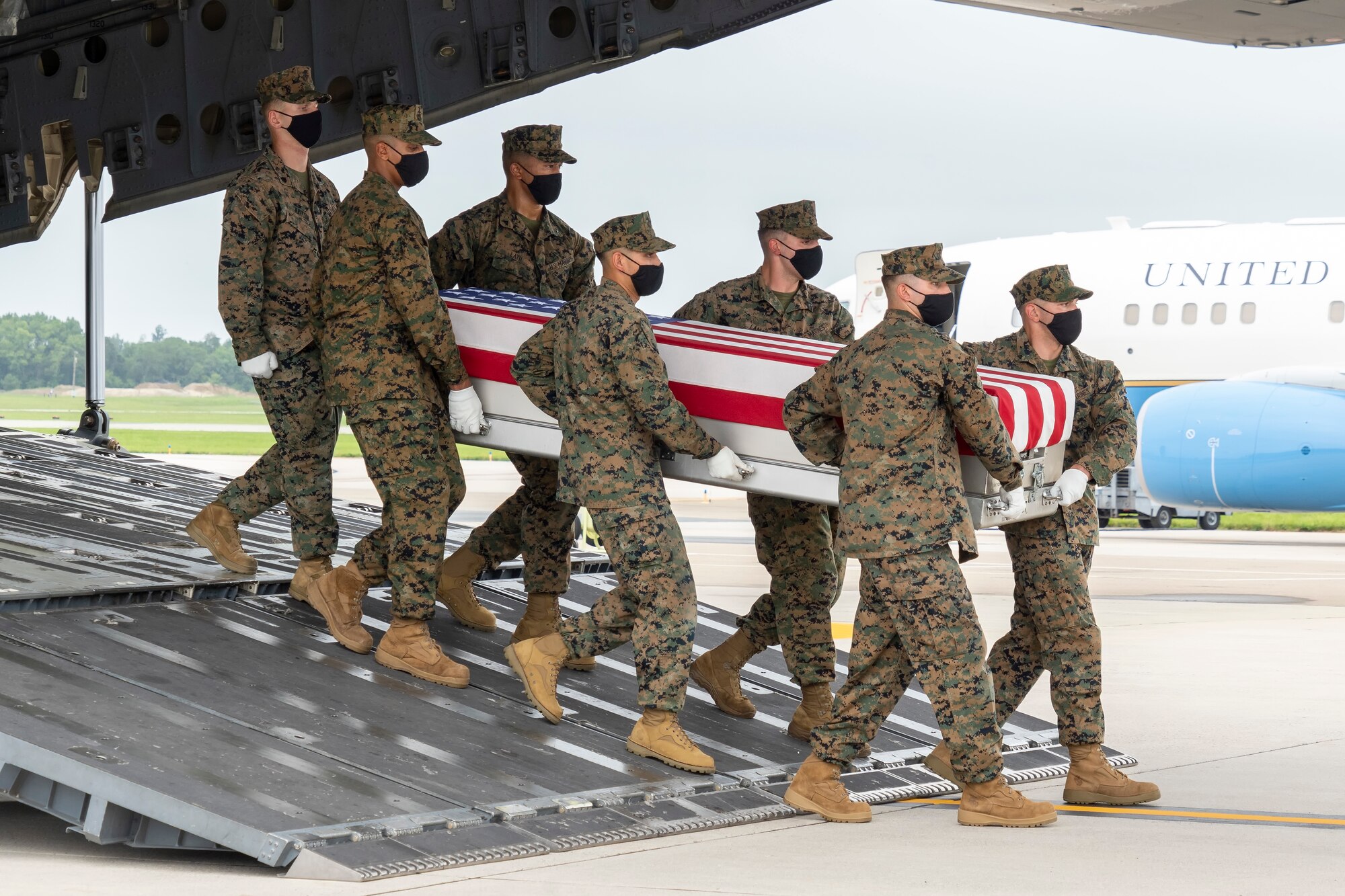 A U.S. Marine Corps carry team transfers the remains of Marine Corps Lance Cpl. Dylan R. Merola of Rancho Cucamonga, California, Aug. 29, 2021 at Dover Air Force Base, Delaware. Merola was assigned to 2nd Battalion, 1st Marine Regiment, 1st Marine Division, I Marine Expeditionary Force, Camp Pendleton, California. (U.S. Air Force photo by Jason Minto)