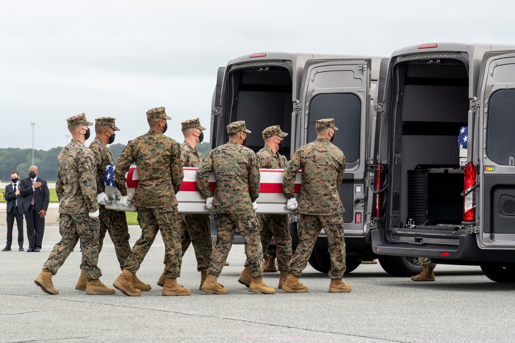 A U.S. Marine Corps carry team transfers the remains of Marine Corps Lance Cpl. Dylan R. Merola of Rancho Cucamonga, California, Aug. 29, 2021 at Dover Air Force Base, Delaware. Merola was assigned to 2nd Battalion, 1st Marine Regiment, 1st Marine Division, I Marine Expeditionary Force, Camp Pendleton, California. (U.S. Air Force photo by Jason Minto)