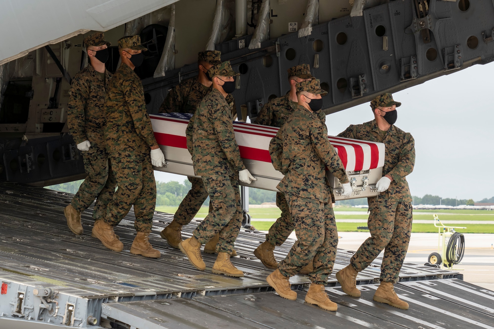 A U.S. Marine Corps carry team transfers the remains of Marine Corps Cpl. Humberto A. Sanchez of Logansport, Indiana, Aug. 29, 2021 at Dover Air Force Base, Delaware. Sanchez was assigned to 2nd Battalion, 1st Marine Regiment, 1st Marine Division, I Marine Expeditionary Force, Camp Pendleton, California. (U.S. Air Force photo by Jason Minto)