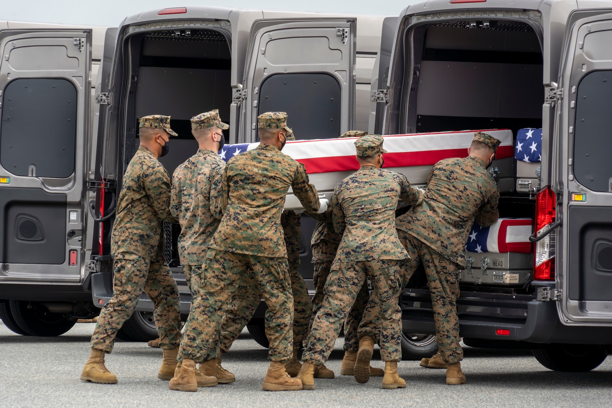 A U.S. Marine Corps carry team transfers the remains of Marine Corps Cpl. Humberto A. Sanchez of Logansport, Indiana, Aug. 29, 2021 at Dover Air Force Base, Delaware. Sanchez was assigned to 2nd Battalion, 1st Marine Regiment, 1st Marine Division, I Marine Expeditionary Force, Camp Pendleton, California. (U.S. Air Force photo by Jason Minto)