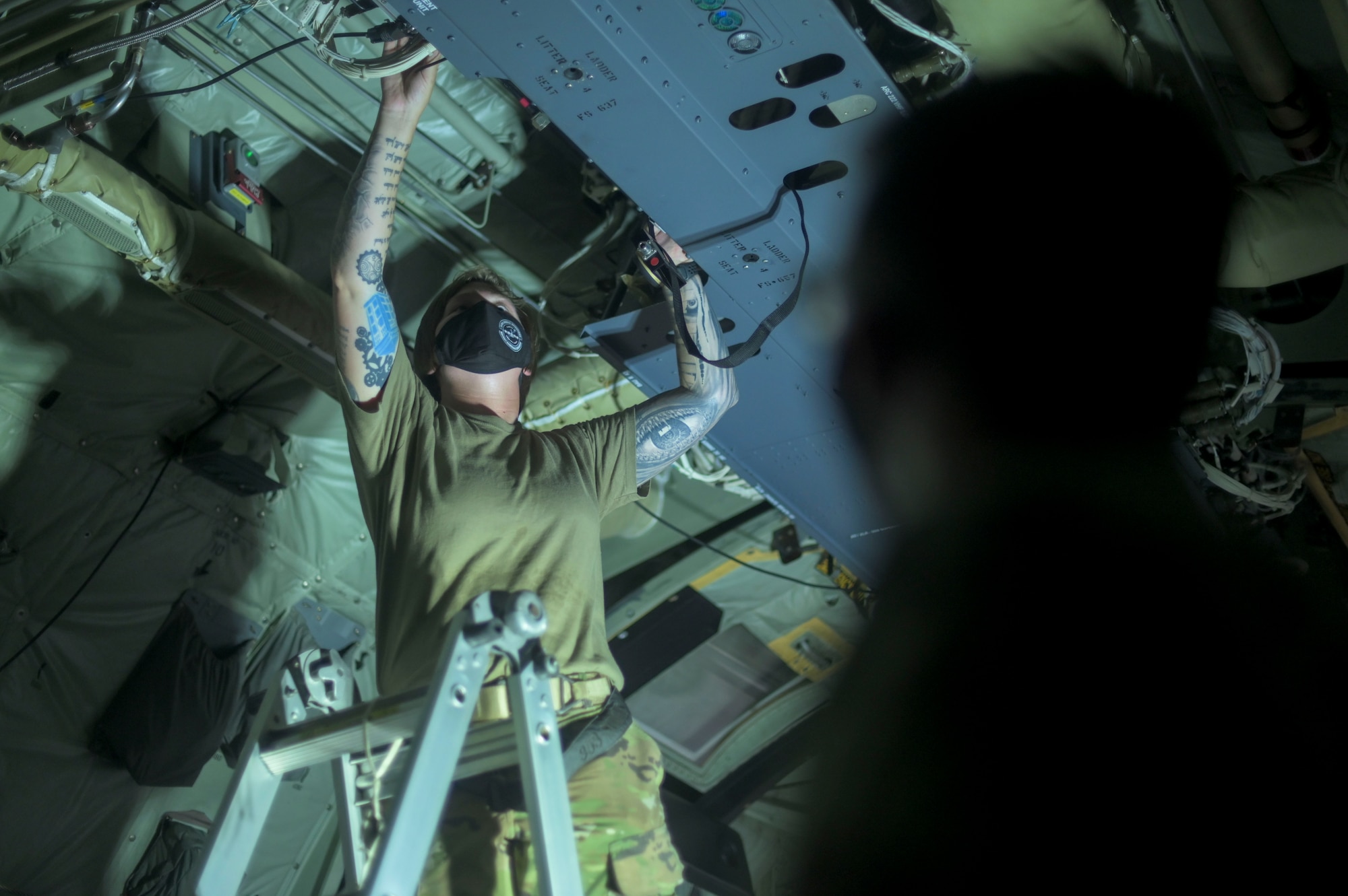 Airman removes aircraft part from C-130