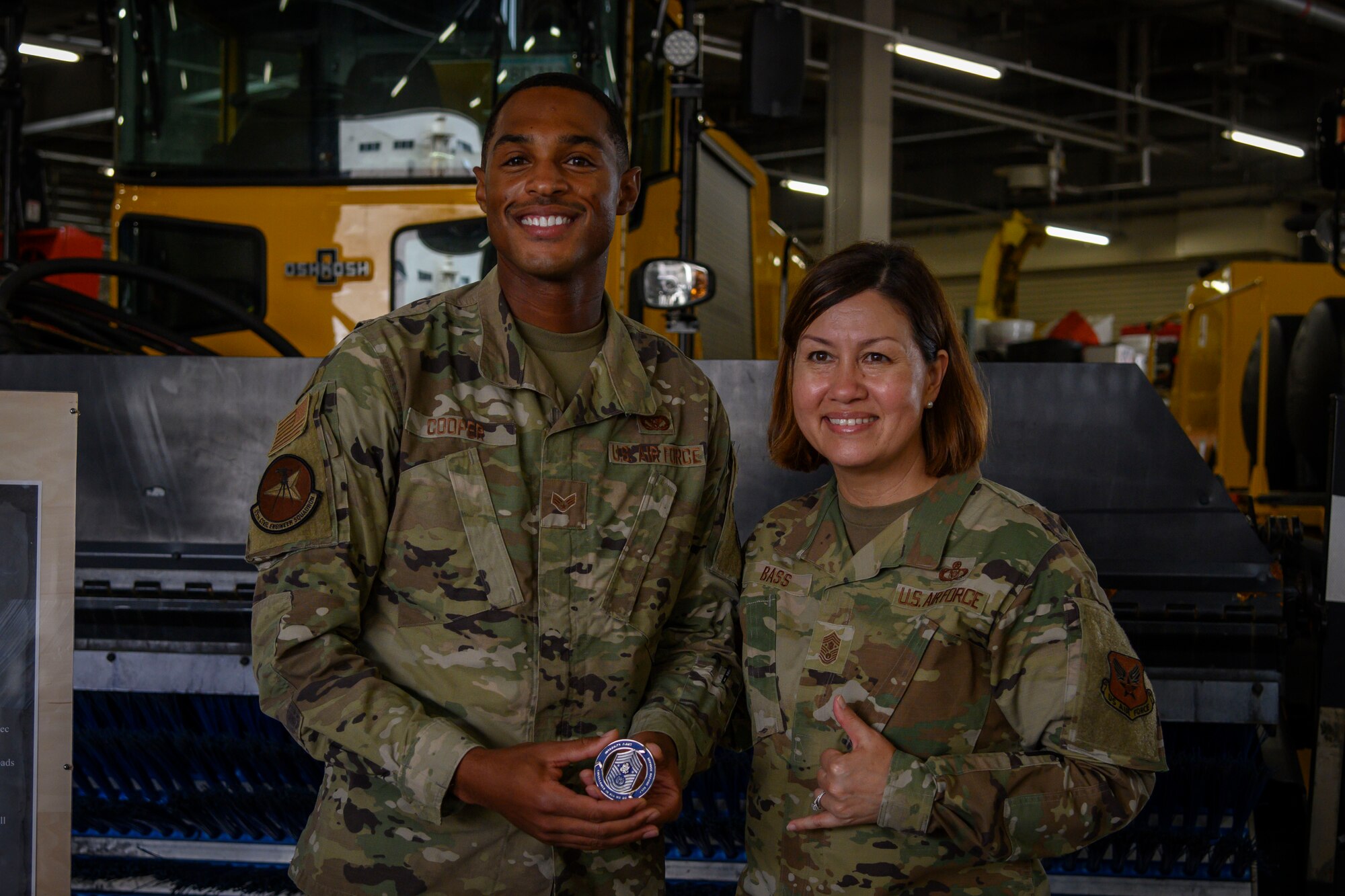 Chief Master Sergeant of the Air Force JoAnne S. Bass coins Airmen during a base tour Aug. 24, 2021, at Misawa Air Base, Japan. The Airmen were recommended by their leadership because they have exceeded expectations and support CMSAF’s priorities of people, readiness and culture. During the visit Bass also emphasized the necessity to accelerate change through Agile Combat Employment and Multi-Capable Airmen training. (U.S. Air Force photo by Senior Airman China Shock)