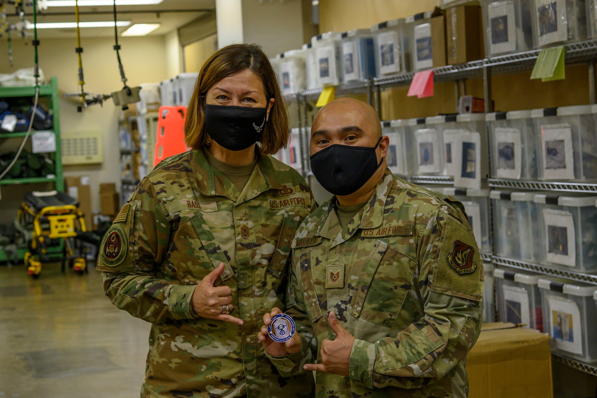 Chief Master Sergeant of the Air Force JoAnne S. Bass coins Airmen during a base tour Aug. 24, 2021, at Misawa Air Base, Japan. The Airmen were recommended by their leadership because they have exceeded expectations and support CMSAF’s priorities of people, readiness and culture. During the visit Bass also emphasized the necessity to accelerate change through Agile Combat Employment and Multi-Capable Airmen training. (U.S. Air Force photo by Senior Airman China Shock)