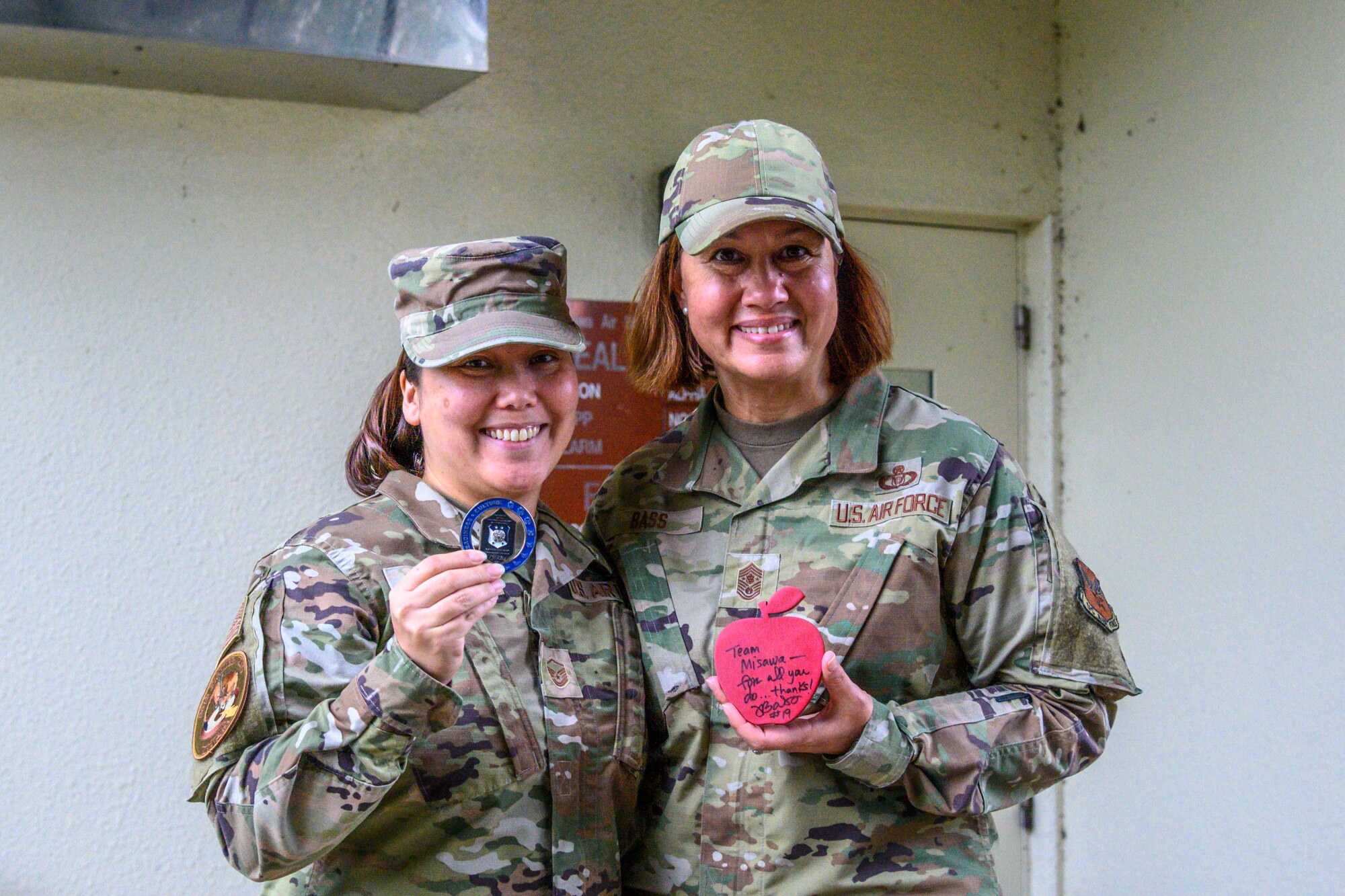Chief Master Sergeant of the Air Force JoAnne S. Bass coins Airmen during a base tour Aug. 24, 2021, at Misawa Air Base, Japan. The Airmen were recommended by their leadership because they have exceeded expectations and support CMSAF’s priorities of people, readiness and culture. During the visit Bass also emphasized the necessity to accelerate change through Agile Combat Employment and Multi-Capable Airmen training. (U.S. Air Force photo by Senior Airman China Shock)