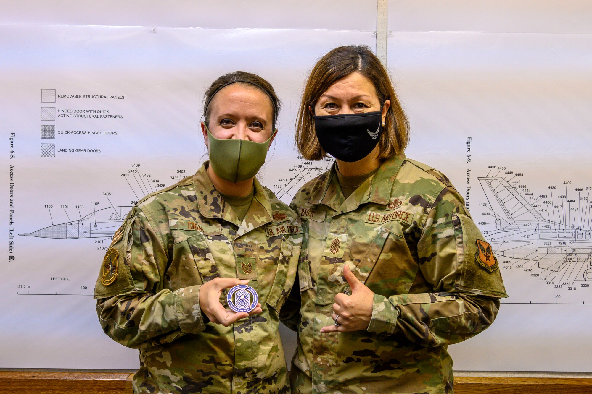 Chief Master Sergeant of the Air Force JoAnne S. Bass coins Airmen during a base tour Aug. 24, 2021, at Misawa Air Base, Japan. The Airmen were recommended by their leadership because they have exceeded expectations and support CMSAF’s priorities of people, readiness and culture. During the visit Bass also emphasized the necessity to accelerate change through Agile Combat Employment and Multi-Capable Airmen training. (U.S. Air Force photo by Senior Airman China Shock)