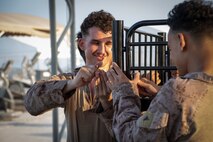 210828-N-ZA692-1556 U.S. service members deliver supplies in support of U.S. citizens and evacuees arriving from Afghanistan at a location in the U.S. 5th Fleet area of operations prior to onward travel to the United States. The U.S. 5th Fleet region encompasses nearly 2.5 million square miles of water area and is comprised of 20 countries. (U.S. Navy photo by Mass Communication Specialist 2nd Class Anita Chebahtah)