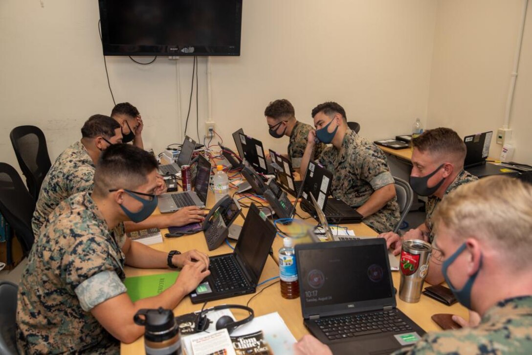 U.S. Marines with 3rd Marine Expeditionary Brigade conduct a command and control exercise in the Combat Operations Center on Camp Courtney, Okinawa, Japan, Aug. 24, 2021. The exercise was conducted with the help of reinforcements from other units across Okinawa to maintain and improve mission readiness. 3D MEB is a ‘Fire Brigade’ force, ready to deploy quickly to respond to crises and contingencies throughout the Indo-Pacific. (U.S. Marine Corps photo by Cpl. Nickolas Beamish)