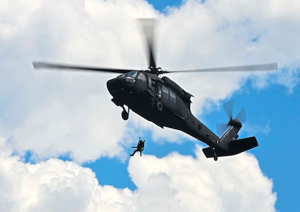 U.S. Army National Guard Soldiers and civilians with the South Carolina Helicopter Aquatic Rescue Team conduct aerial-rescue training in mountainous terrain with the South Carolina Emergency Management Division, Table Rock, South Carolina, Aug. 24, 2021. The event included a variety of training scenarios emphasizing survivor extractions from mountain slopes and tops, as well as aquatic rescue.