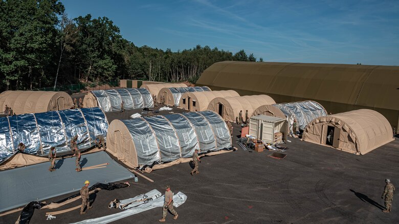 Airmen build pods.