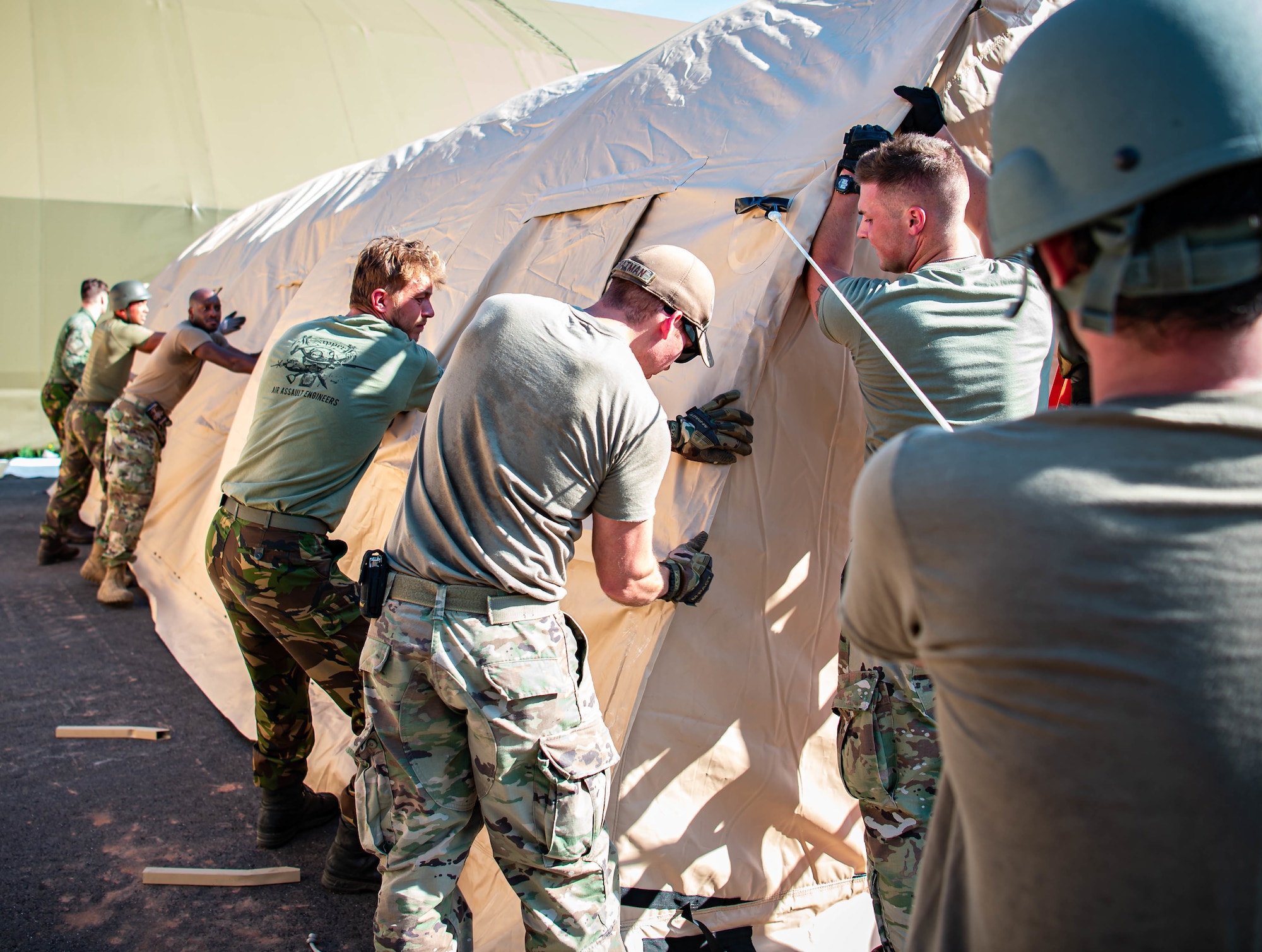 Airmen build pods.