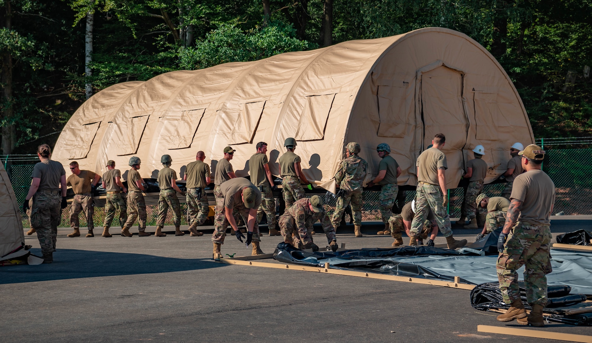 Airmen build pods.