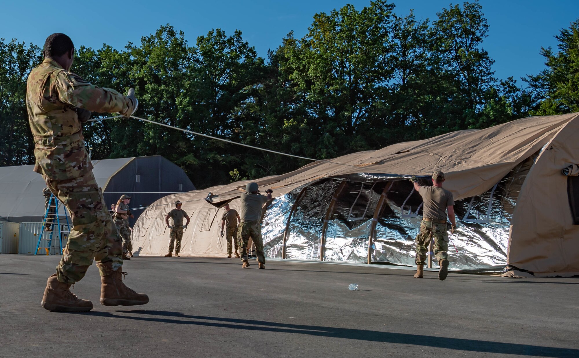 Airmen build pods.