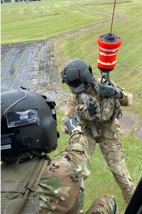 Soldiers with the Louisiana National Guard’s 1st Battalion, 244th Aviation Regiment, rehearse hoist operations to prepare for possible search and rescue missions ahead of Hurricane Ida in Hammond, Louisiana, Aug. 28, 2021. In addition to 195 high-water vehicles and 73 rescue boats prepped and staged across south Louisiana, the LANG has 34 helicopters ready to support search and rescue, evacuation and recon missions.