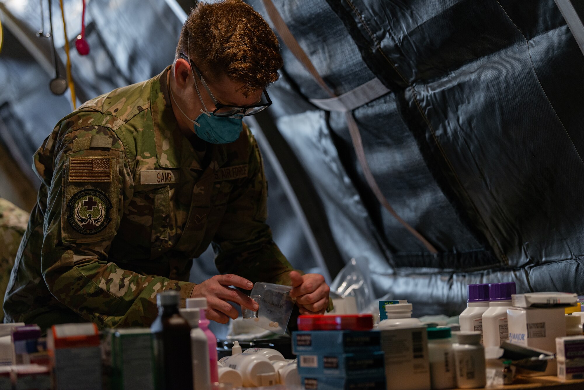 Airmen prepare medical care for evacuees.